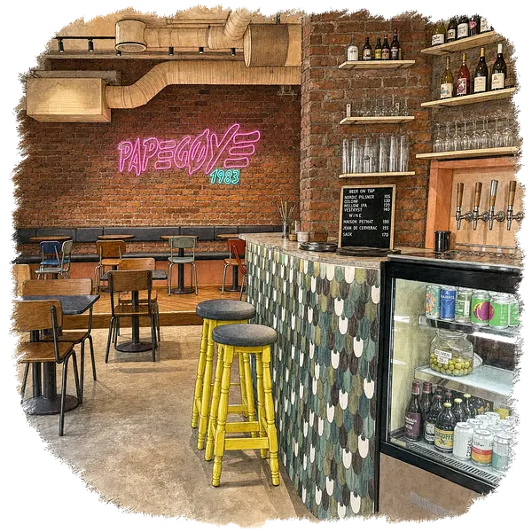 Papegøye coffee bar interior in Oslo with brick, neon, and colorful cafe seating.